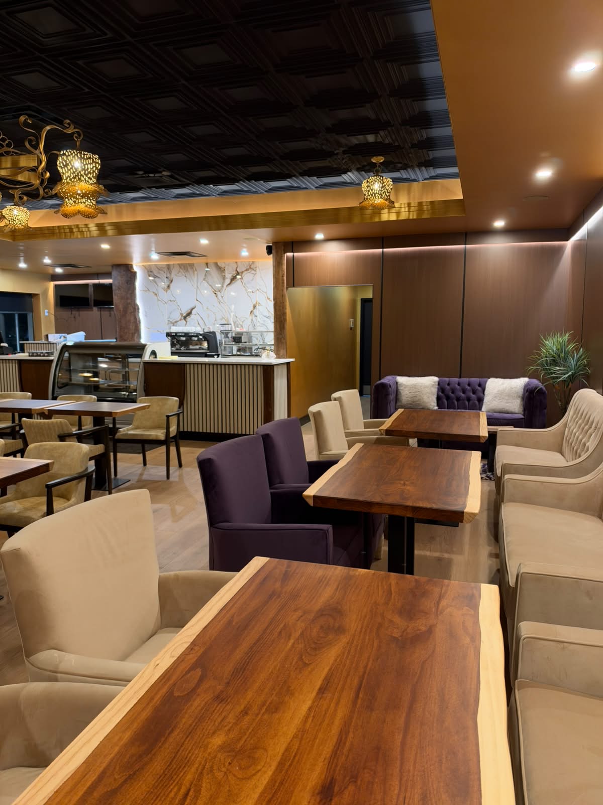 Cream and plum seating throughout the Lavend'Or café